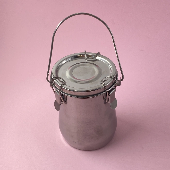 A large metal salt container